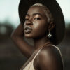 Model wearing square earrings